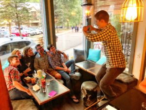 People posing for a photo inside a restaurant